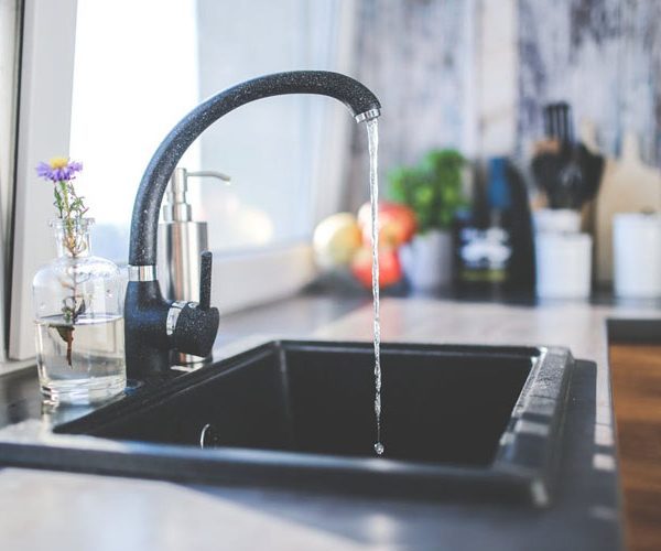 Sink with running tap water